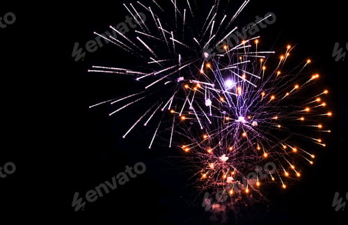 Preview: Colorful fireworks in the sky on black background. celebratory salute, fireworks