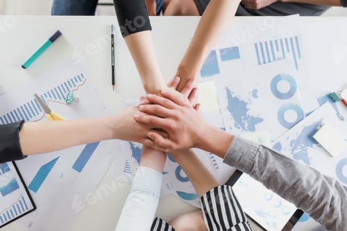 Preview: Group of people doing handshake and cross hands