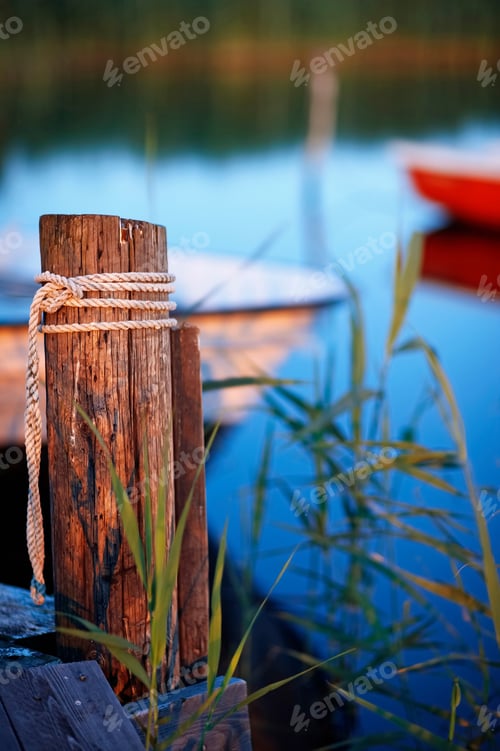 Preview: Rope tied on wooden post at dock