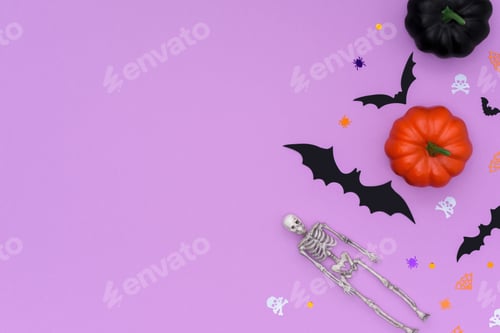 Preview: Halloween border made of colorful pumpkins, skeleton and bats on a purple background.