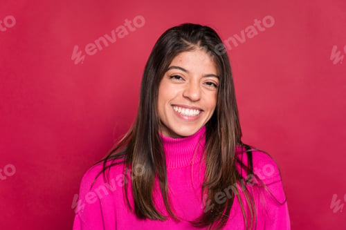 Preview: Smiling young woman looking at camera and looking at camera
