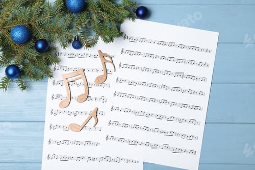 Preview: Composition with wooden music notes and Christmas balls on table, top view