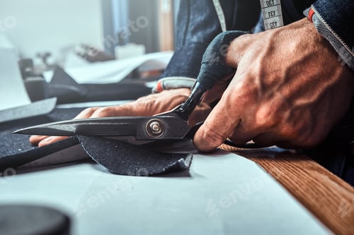 Preview: Craftsperson Cutting Fabric with Tailoring Scissors