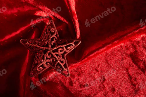 Preview: Abstract Christmas background with star on a red velvet background.