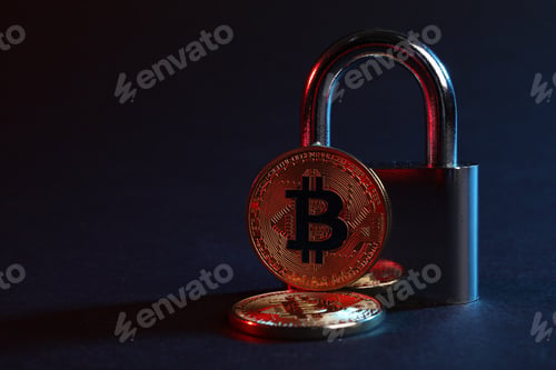 Preview: Bitcoins and padlock on blue background in red light, closeup with space for text