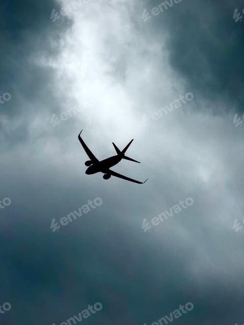 Preview: Silhouette of Plane Flying in a Turbulent Sky