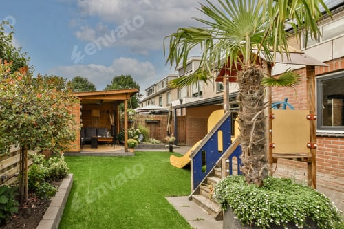 Preview: Neat patio with sitting area with playground