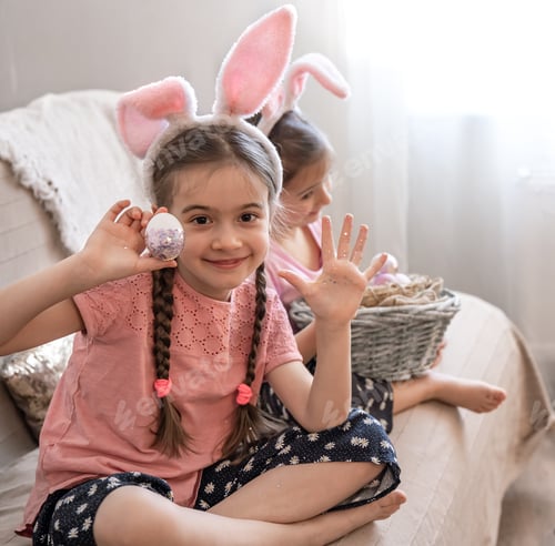 Preview: Girls Wearing Bunny Ears With Decorated Easter Eggs