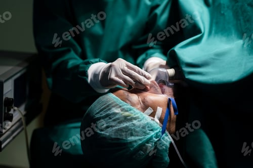 Preview: Anesthesiologist wearing a mask to anesthetize the patient for surgery.