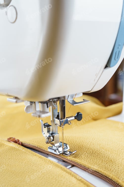 Preview: Modern Sewing Machine With Yellow Velours Fabric Close Up