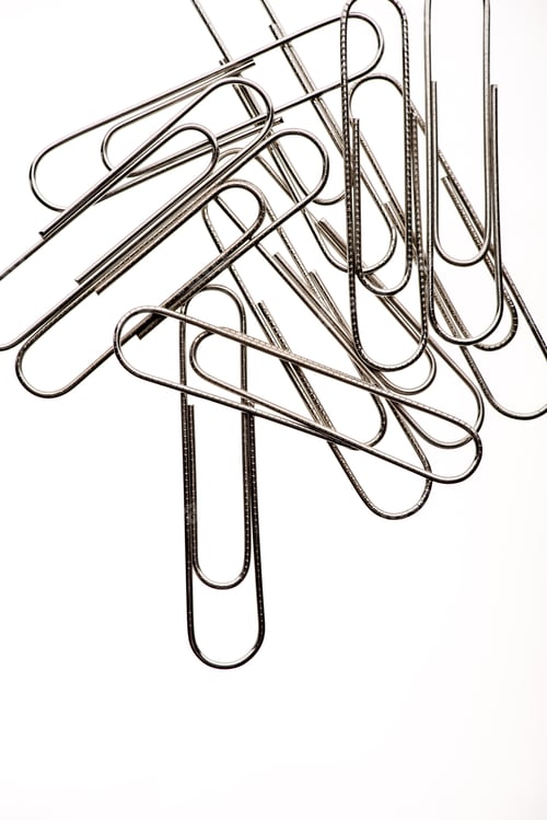 Preview: Close-up view of pile of paper clips on white
