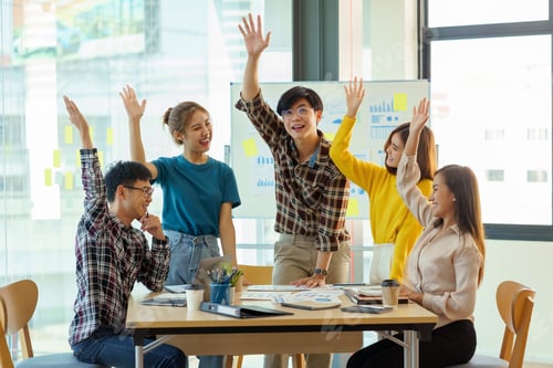 Preview: Happy group of young Asian business people successful excited raised hands rejoicing.