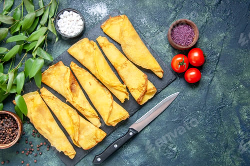 Preview: top view tasty rolled pancakes lined with tomatoes on dark background color meal pie meat dough