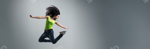 Preview: Dynamic Jumping Woman on Wide Banner with Copy Space