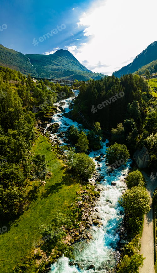 Preview: View of the river Geirangerelvi and the waterfall Storfossen in Geiranger, Norway.