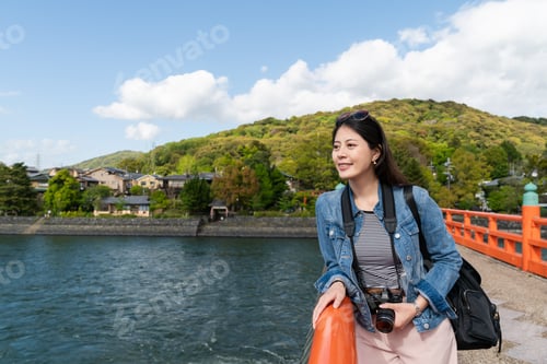 Preview: girl enjoying breeze on uji bashi bridge