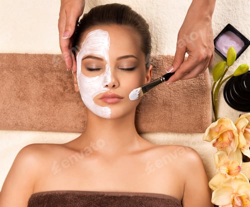 Preview: Woman having a facial cosmetic mask at spa salon.