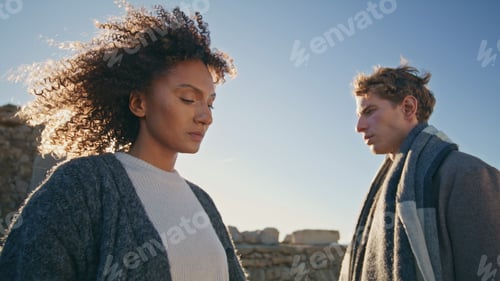 Preview: Upset models standing sunset beach closeup. Multiracial man woman contemplating