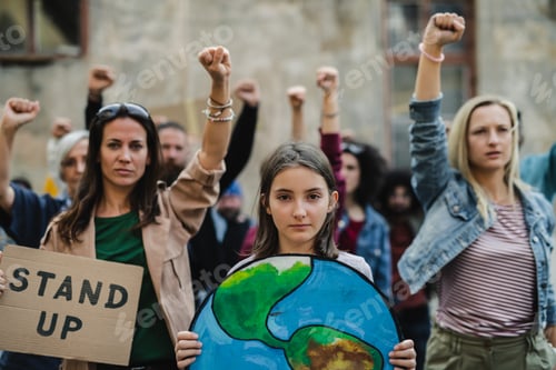 Preview: Group of people activists protesting on streets, strike and demonstration concept.