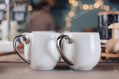 Preview: Two beautiful white cups on the festive table