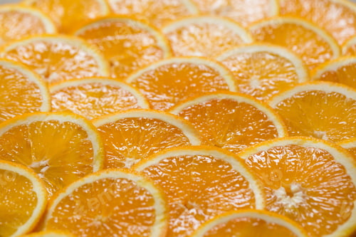 Preview: Bright orange background from slices of juicy Orange. Healthy food, background.