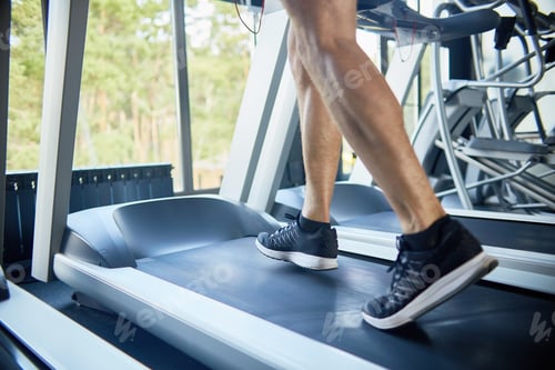 Preview: Sporty Man Running on Treadmill