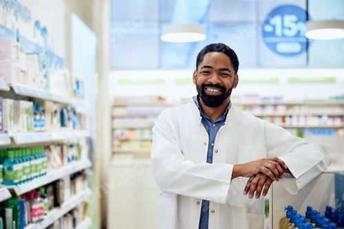 Preview: Confident Pharmacist Standing in a Bright Pharmacy With a Friendly Smile