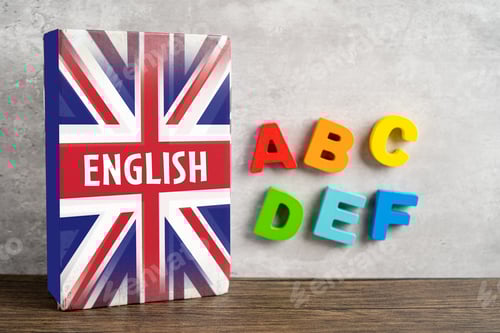 Preview: Word English on book with United Kingdom flag, learning English language courses concept.