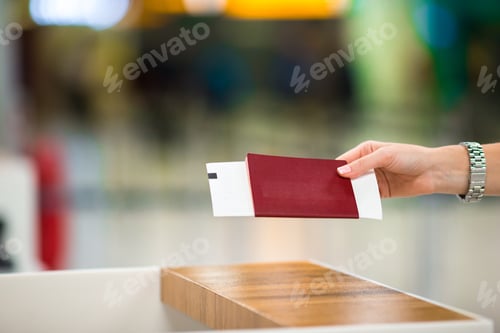 Preview: Closeup passports and boarding pass at airport indoor
