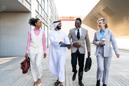 Preview: Group of multiethnic business people meeting an emirati businessman