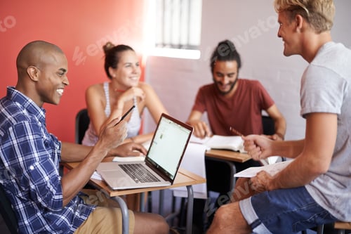 Preview: Positivity is their key to studying. Shot of a group of university students studying together.
