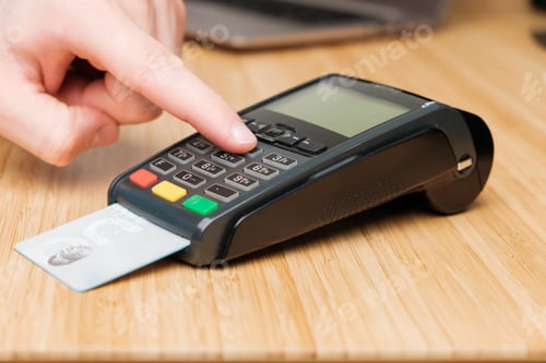 Preview: Man hand enters pin code on the terminal for payment