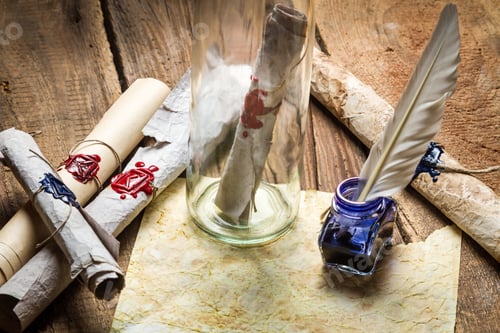 Preview: Preparing to send ancient letter in a bottle and writting with blue ink