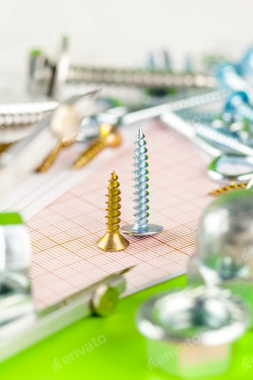 Preview: technology and metalworking. Metal bolt and nut on printed drawings background