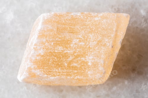 Preview: sample of raw selenite mineral on white marble