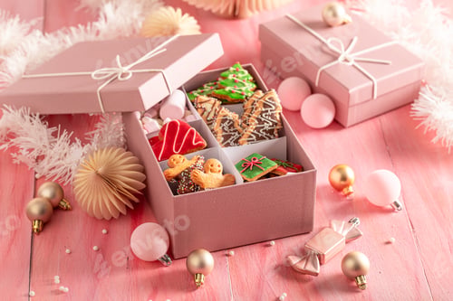 Preview: Homemade Christmas gingerbread cookies with Christmas decorations and baubles..