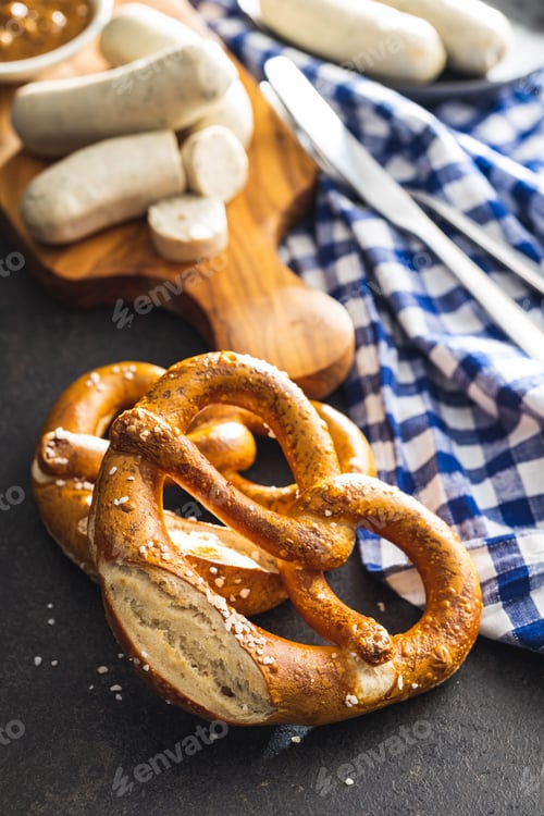 Preview: Baked bavarian pretzels on black table.