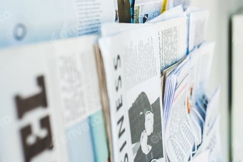 Preview: selective focus of different print newspapers on stand