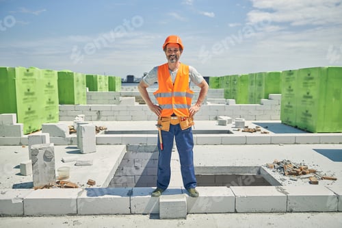 Preview: Male worker standing at a building site