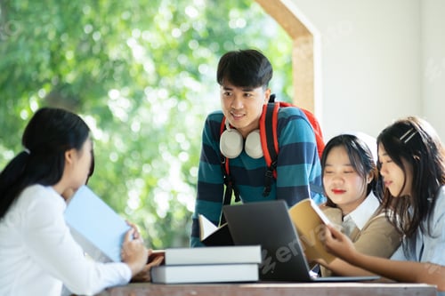 Preview: Group of students studying on campus outdoors