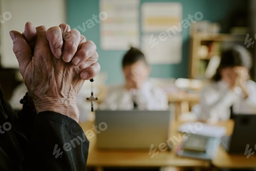 Preview: Holding Rosary Beads in Religious Classroom Setting