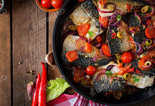 Preview: Grilled mackerel with vegetables in Mediterranean style. Top view