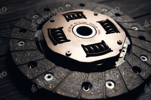 Preview: new car clutch kit on a dark wooden background. Close up