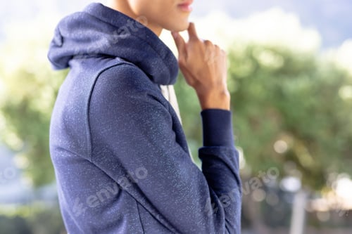 Preview: Image of biracial man in blue long sleeve hooded top with copyspace