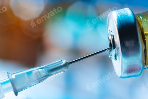 Preview: Vaccine bottle with a syringe taking the vaccine from it