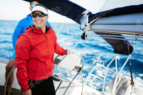Preview: Attractive strong woman sailing with her boat