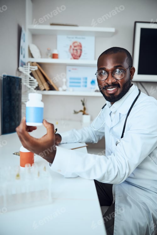 Preview: Multiethnic general practitioner lifting a blue pill bottle