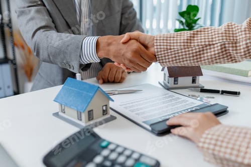 Preview: Two people in business attire finalize a real estate deal