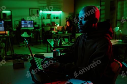 Preview: African American Man Working on Laptop