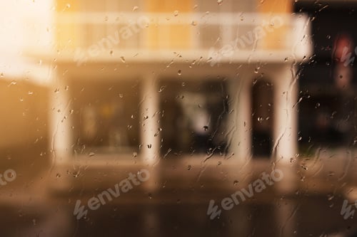 Preview: Rainy city background. Raindrops on window glass on autumn day. Wet home window with raindrops.